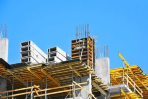 Building construction site work against blue sky