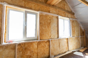 36493039 - inside wall heat isolation with mineral wool in wooden house,  building under construction